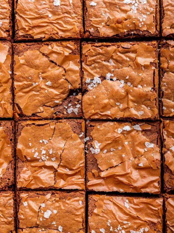 Up close macro shot of 3 ingredient brownies cut into squares.