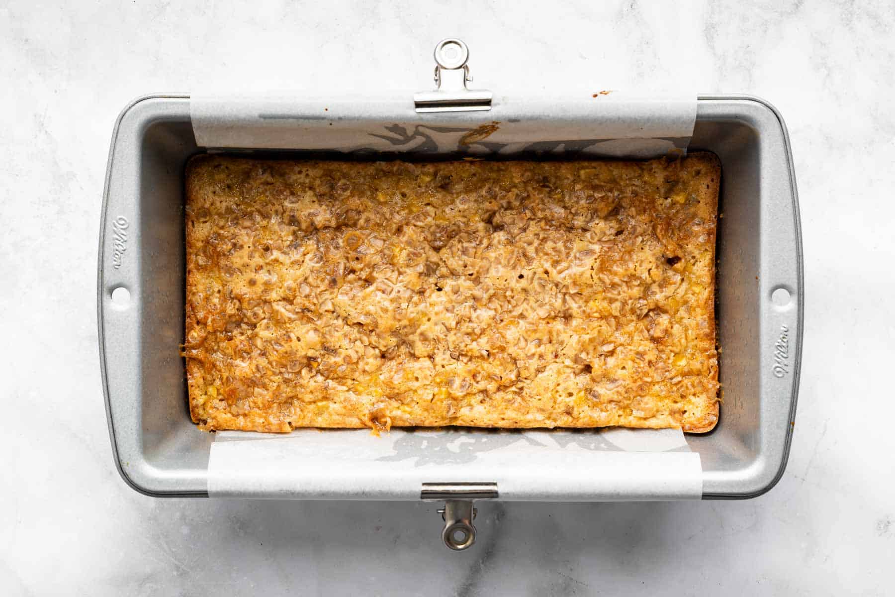 Horizontal image of apple blondies in a bread loaf pan.