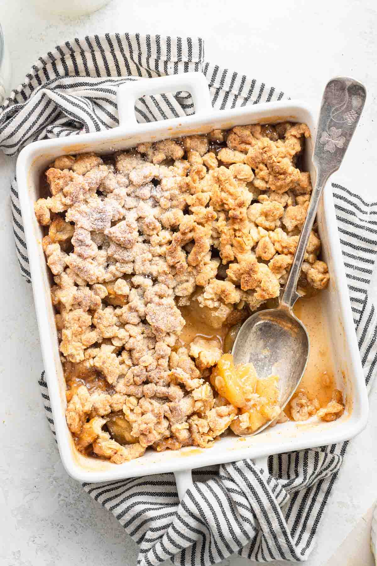 Small apple crisp in small baking dish.