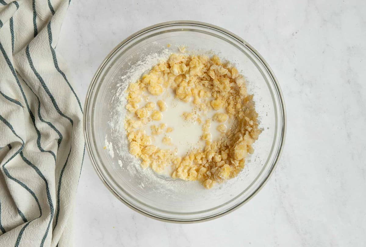 Cookie dough with a splash of milk on top.