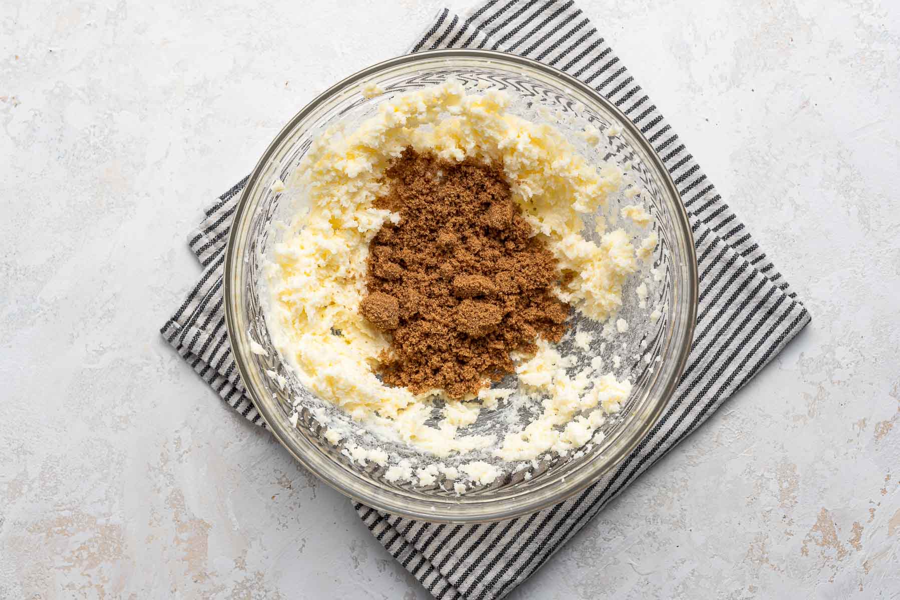 Brown sugar with butter in bowl.
