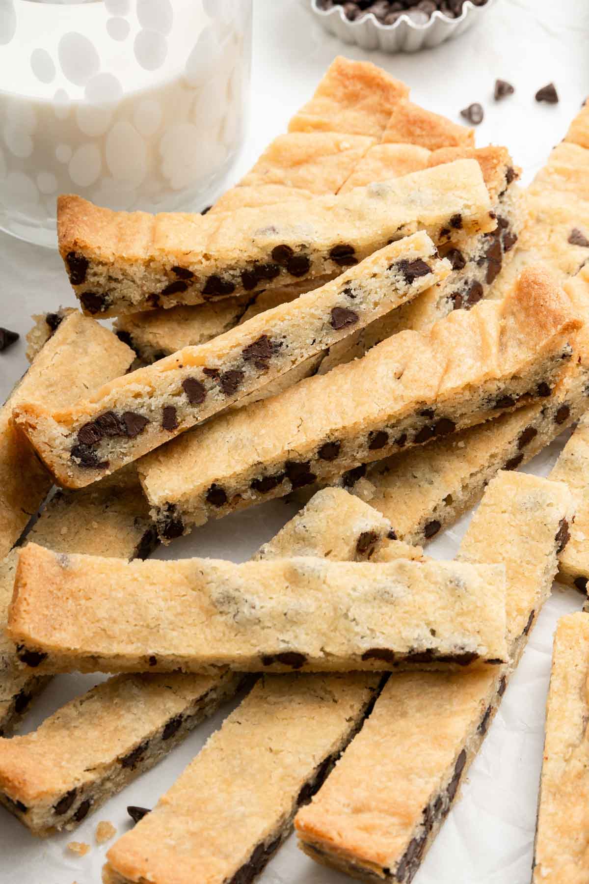 Stack of chocolate chip shortbread cookies on counter.