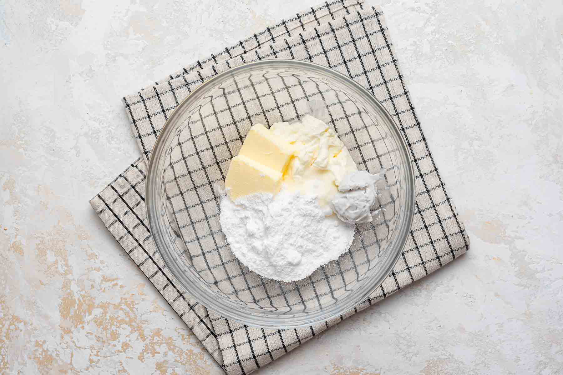Coconut cream cheese frosting in bowl.