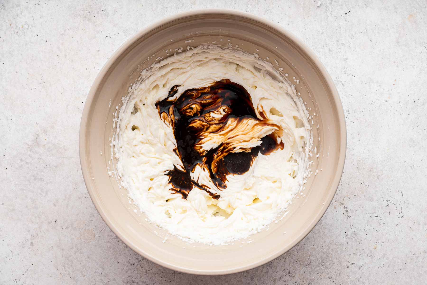 White batter with coffee drizzle on top.