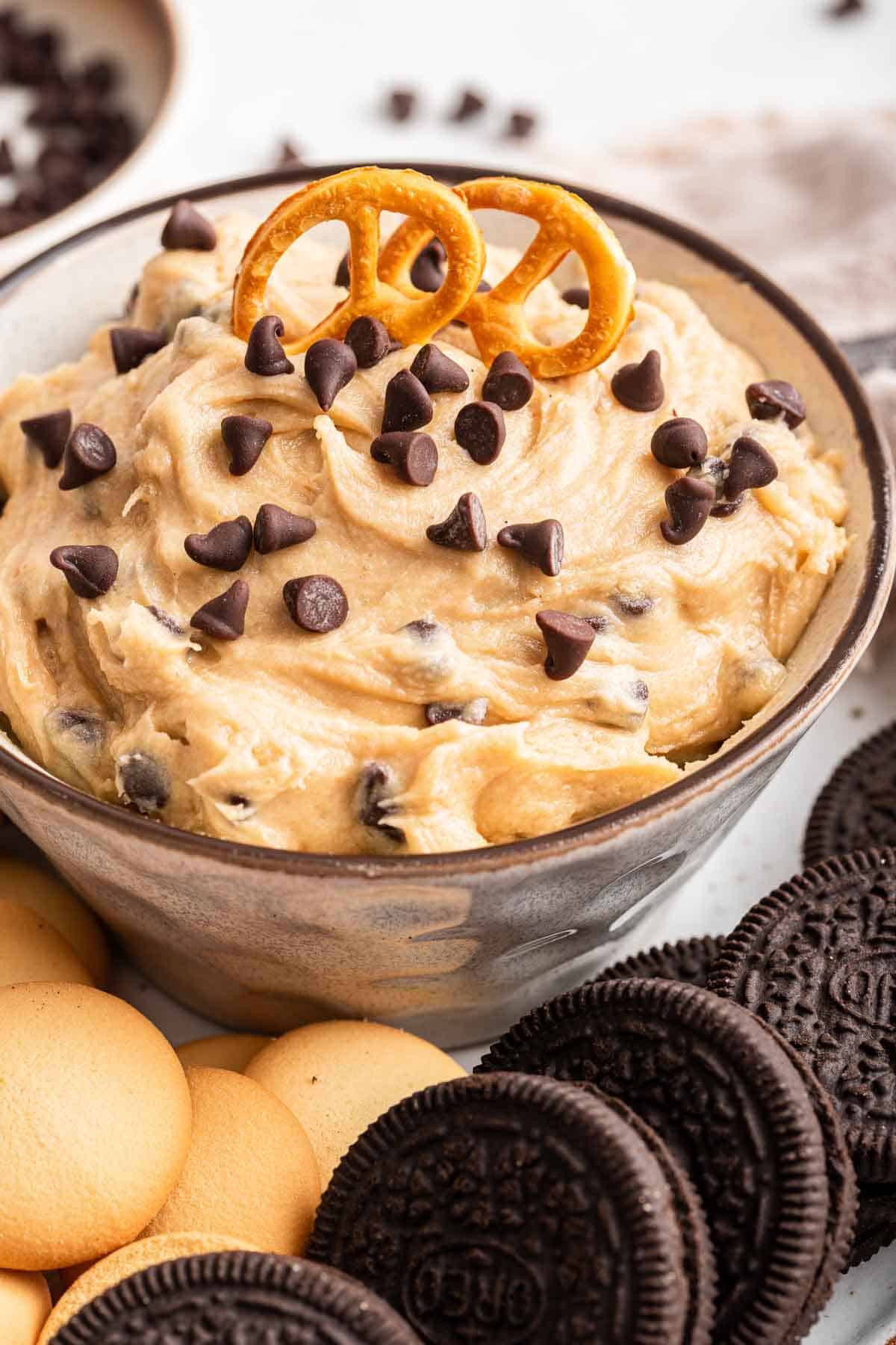 Cookie dough dip with pretzel on top.