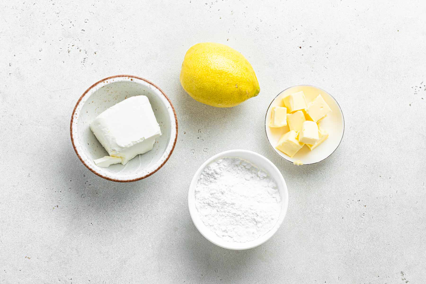 Ingredients for lemon cream cheese frosting.