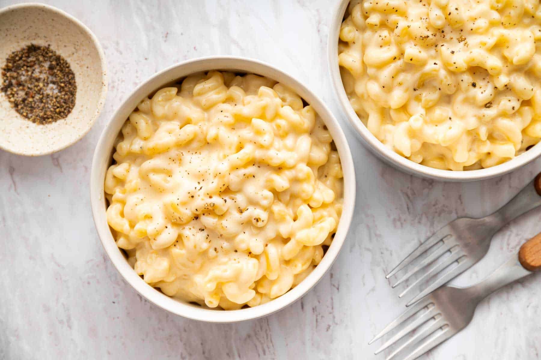 A small batch of macaroni and cheese in two bowls.