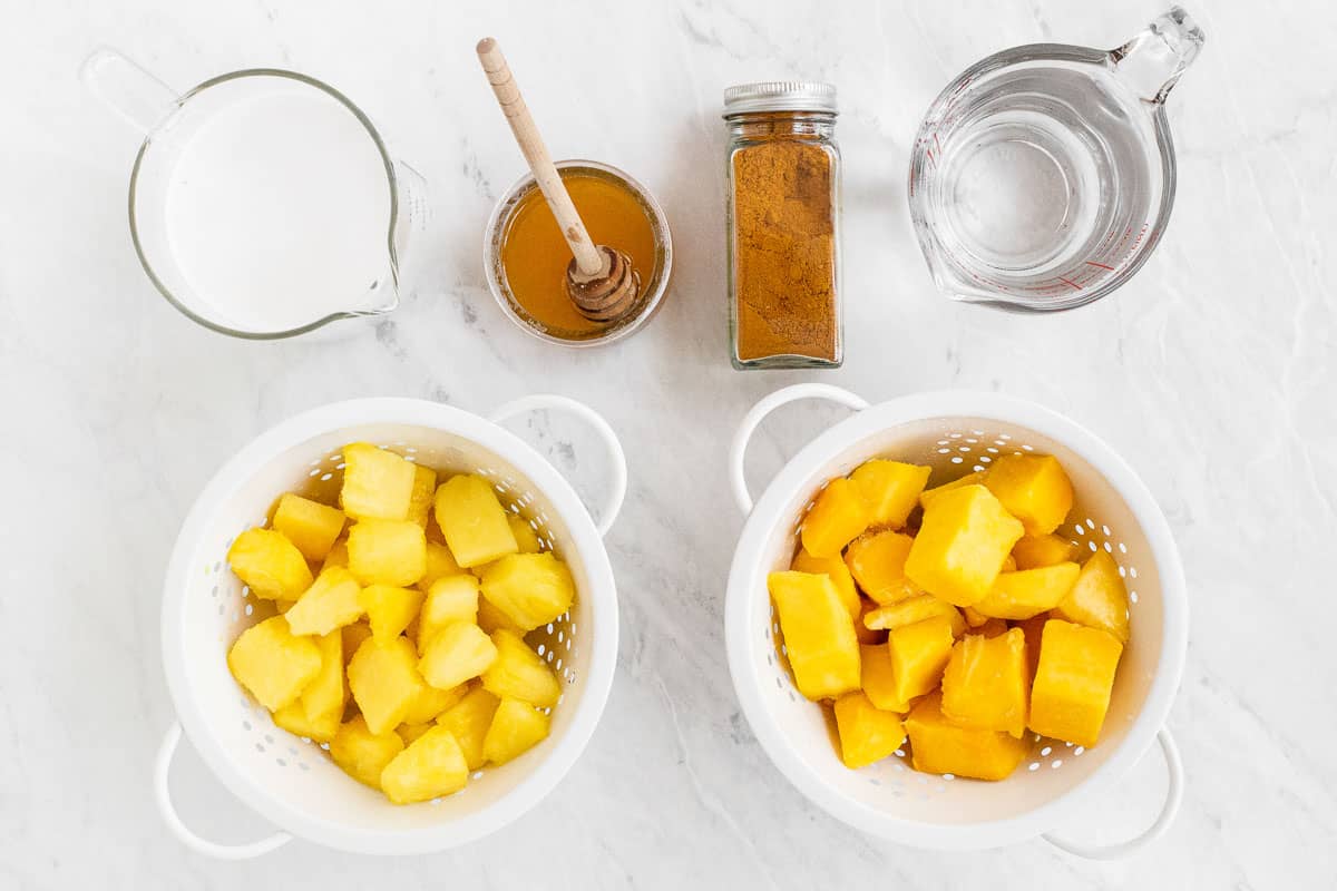 Ingredients for a mango pineapple smoothie