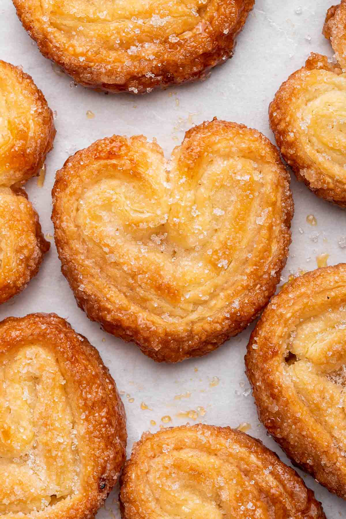 Macro shot of palmiers on white counter.