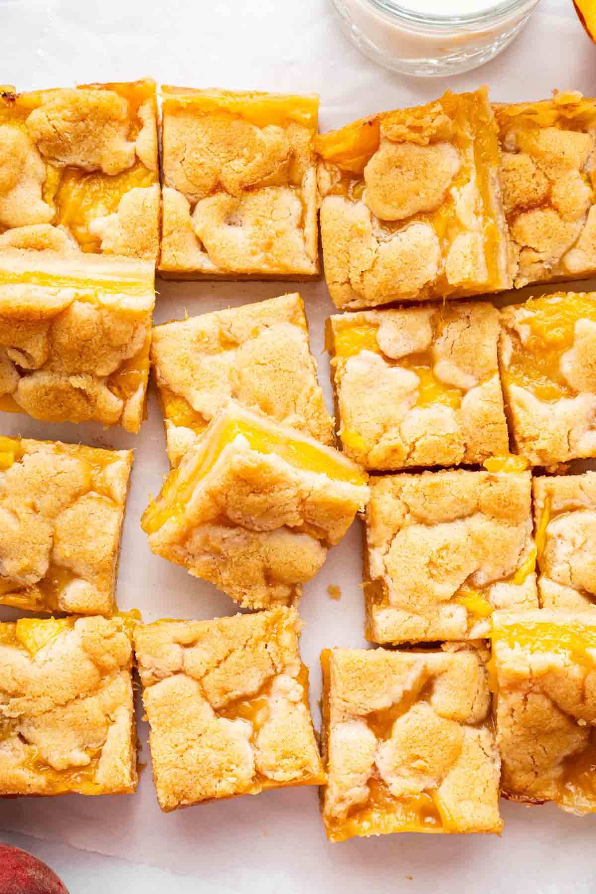 Overhead image of peach bars sliced into squares.