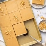 Overhead shot of peanut butter sheet cake cut into 12 equal squares.