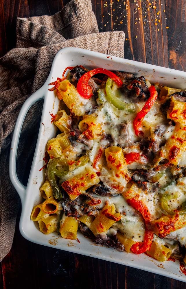 Philly Cheesesteak Pasta. Creamy baked pasta with peppers, onions, and steak.