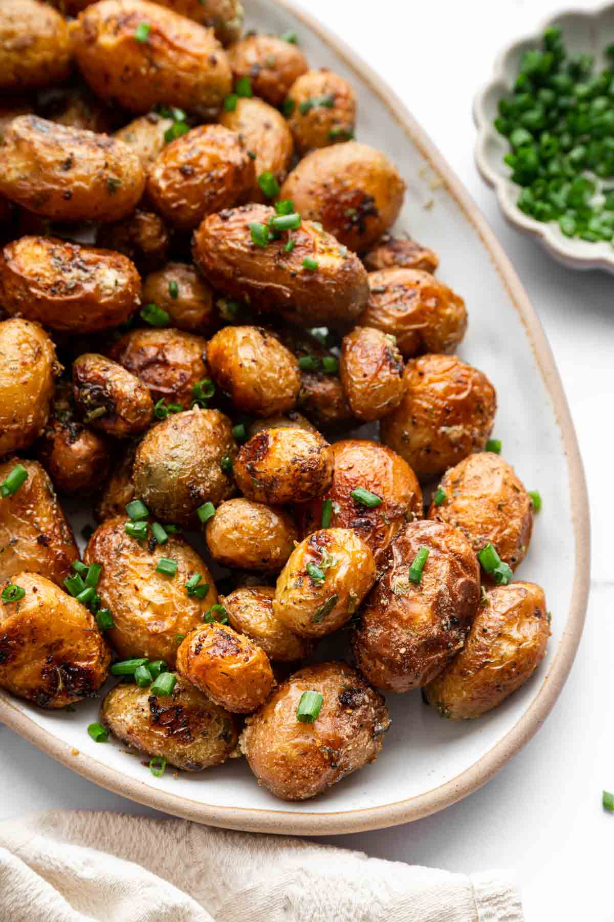 Hero image of roasted ranch potatoes on oval platter.