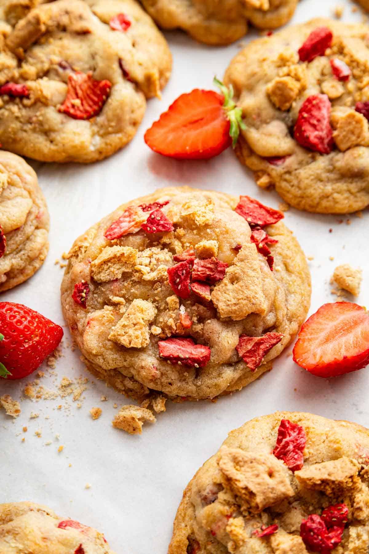 Strawberry cheesecake cookies on white counter.