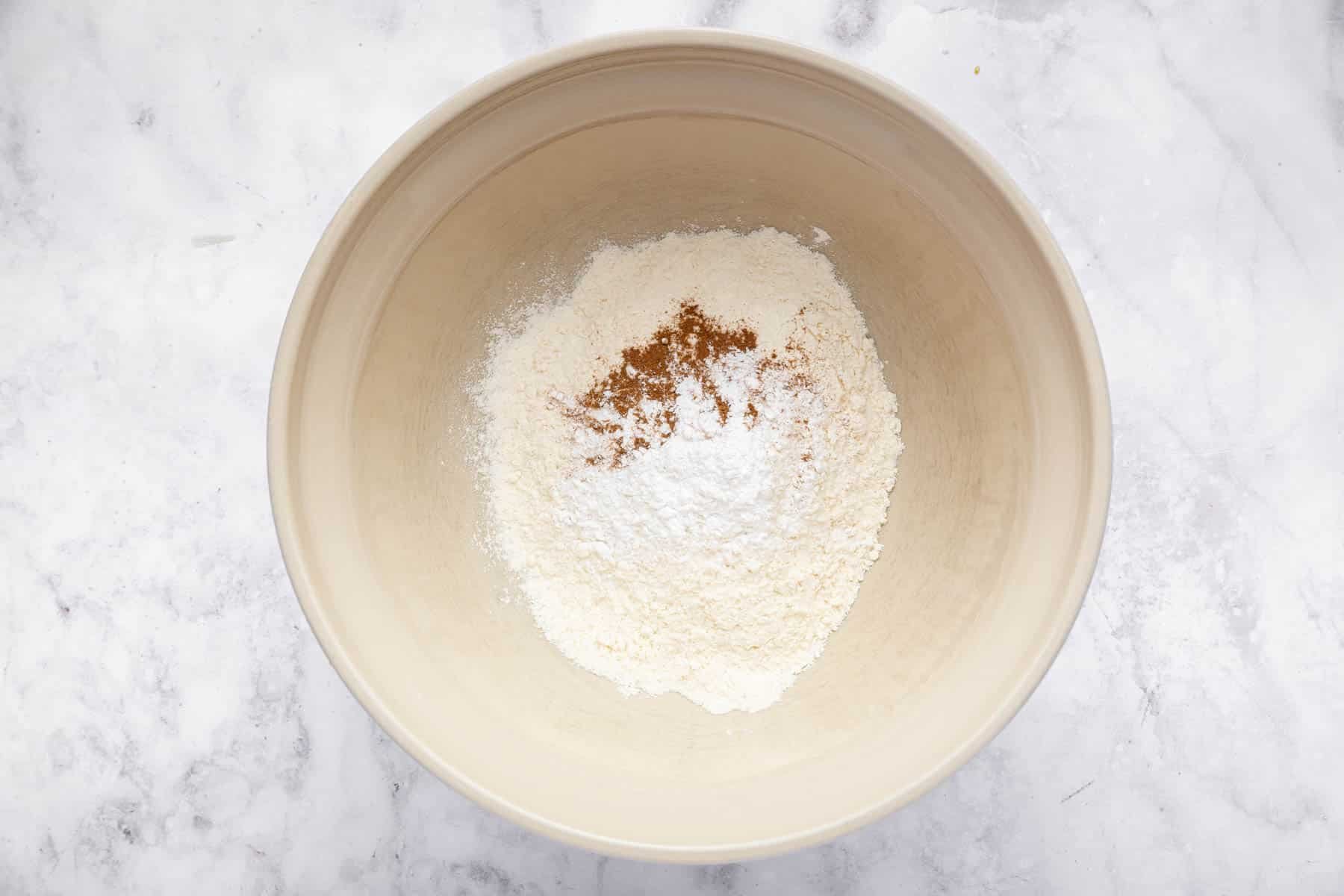 Bowl with dry ingredients being whisked together.